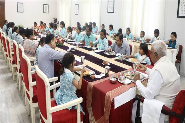 Governor Shri Patel shares lunch with differently abled girls